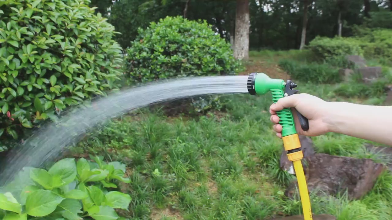 Wall Mounted Hose Holder Installed on Garden Fence for Easy Hose Storage